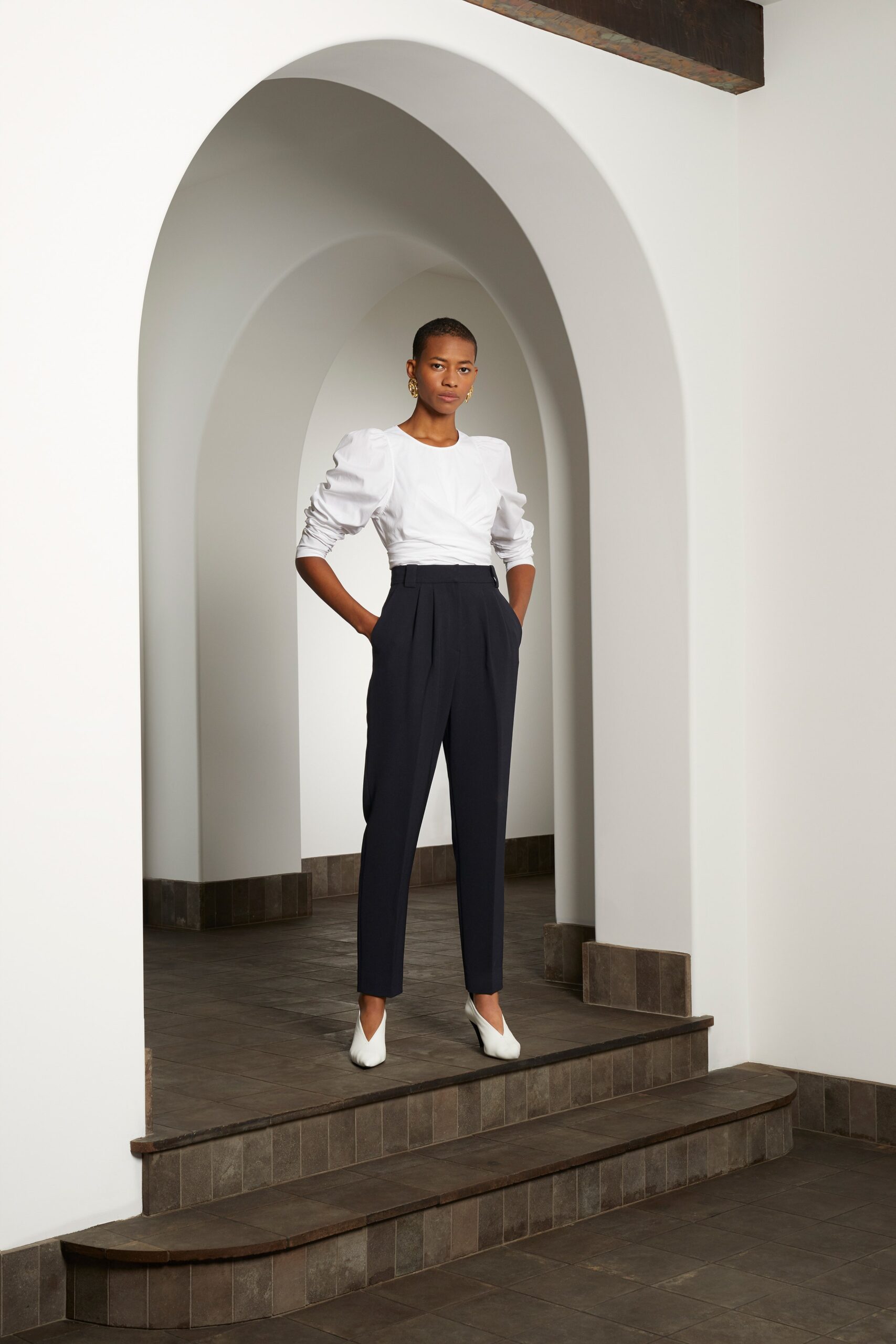 white fitted top with navy tailored pants