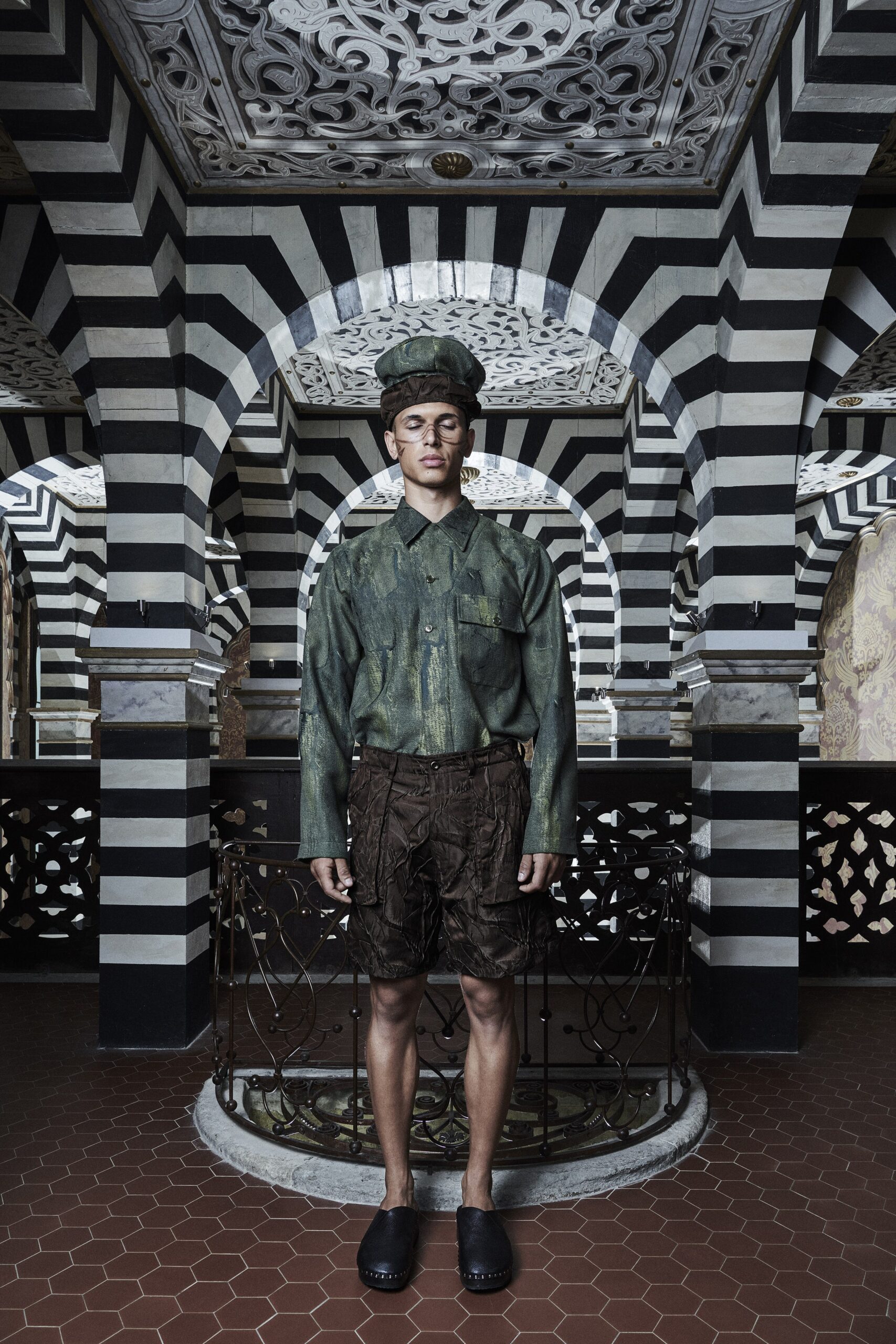 A relaxed green cotton long-sleeve shirt paired with matching shorts featuring a buttoned design.
