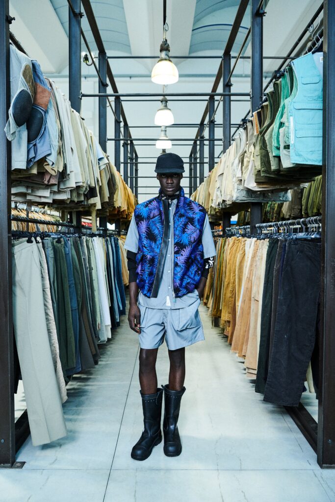 blue printed vest with gray shorts