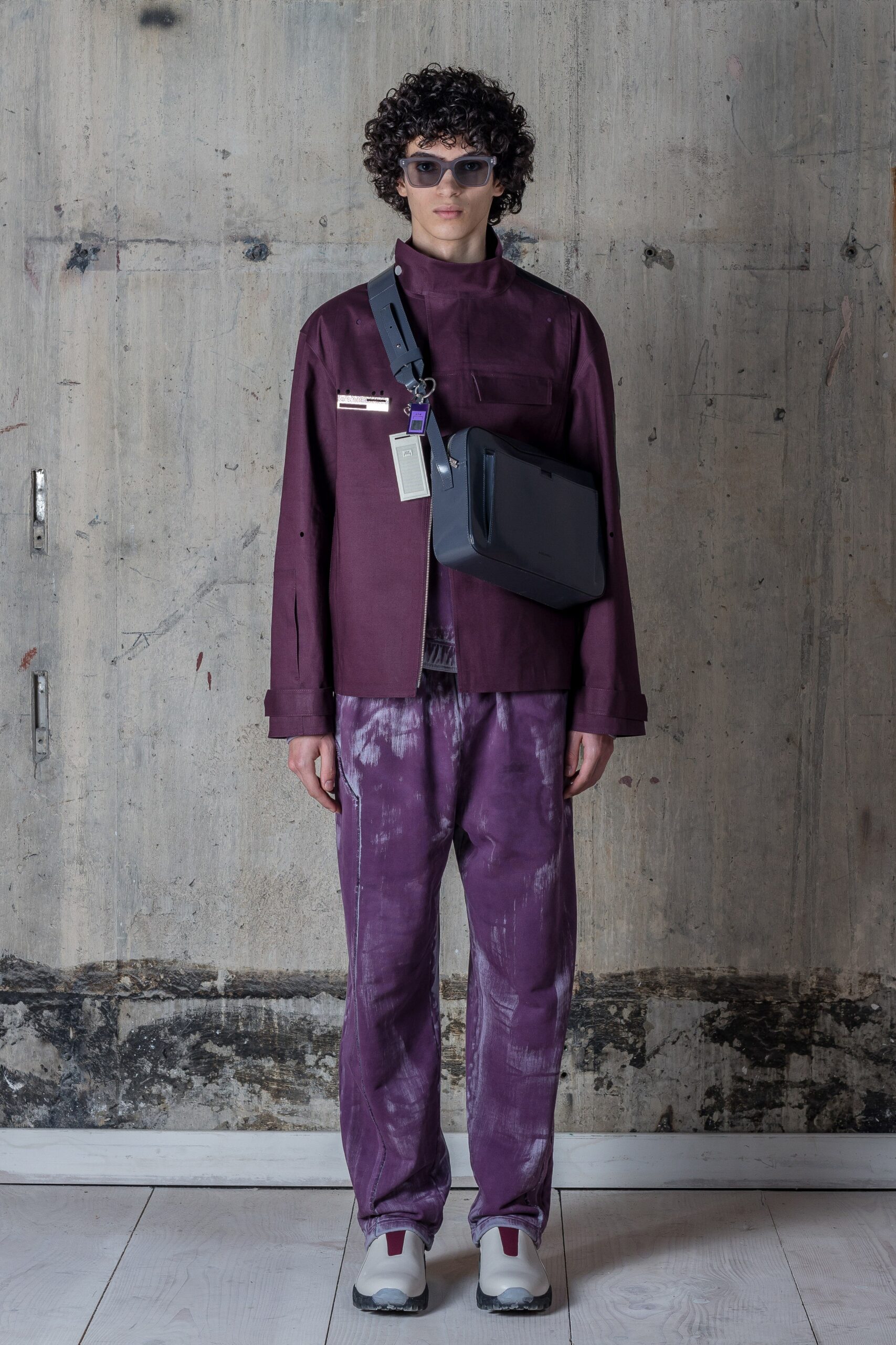 A relaxed purple cotton jacket with long sleeves paired with printed pants.