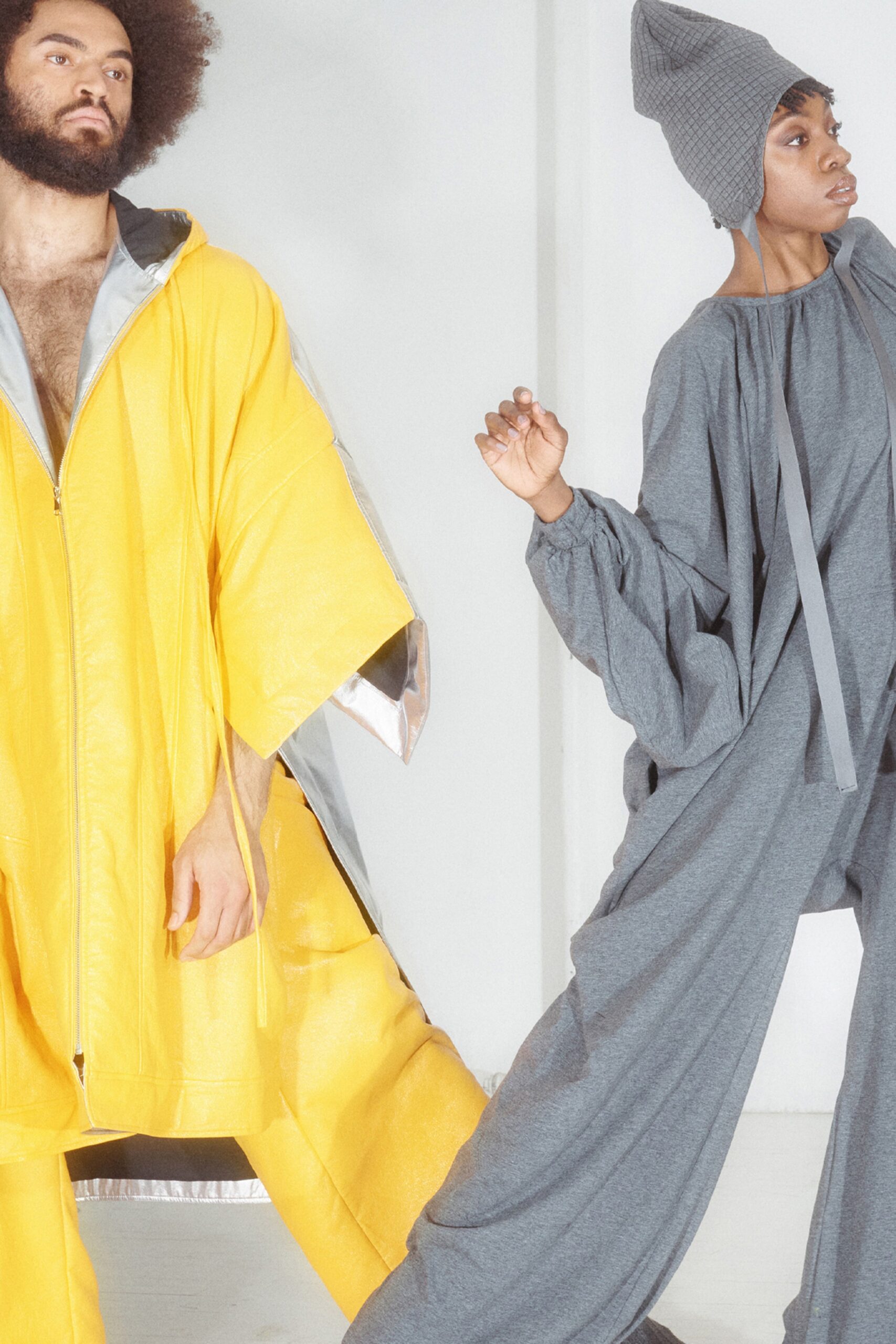 yellow poncho and gray jumpsuit