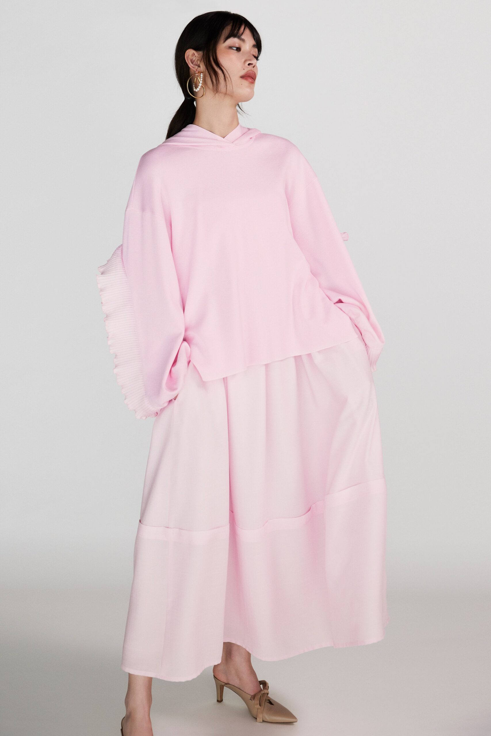 pink hooded top with white tiered skirt