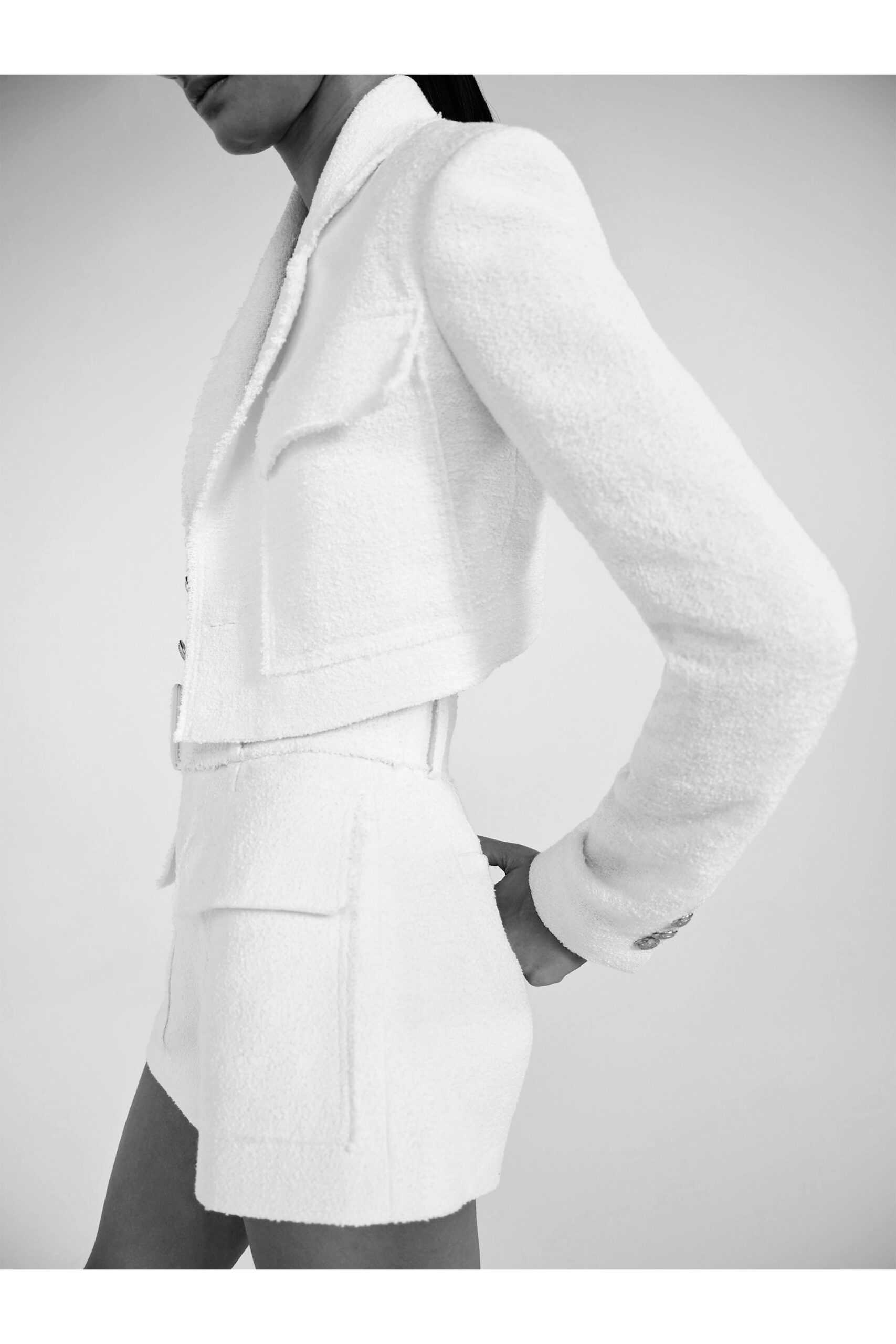 white cotton long-sleeve collared fitted buttoned pockets blazer