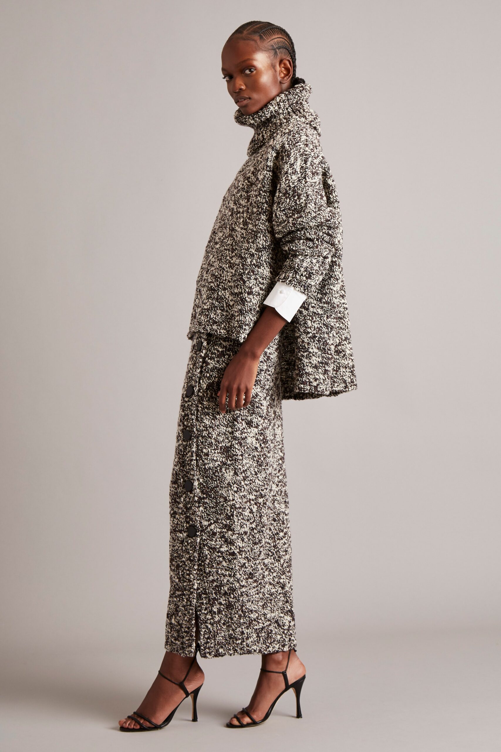 relaxed black and white top with fitted midi skirt