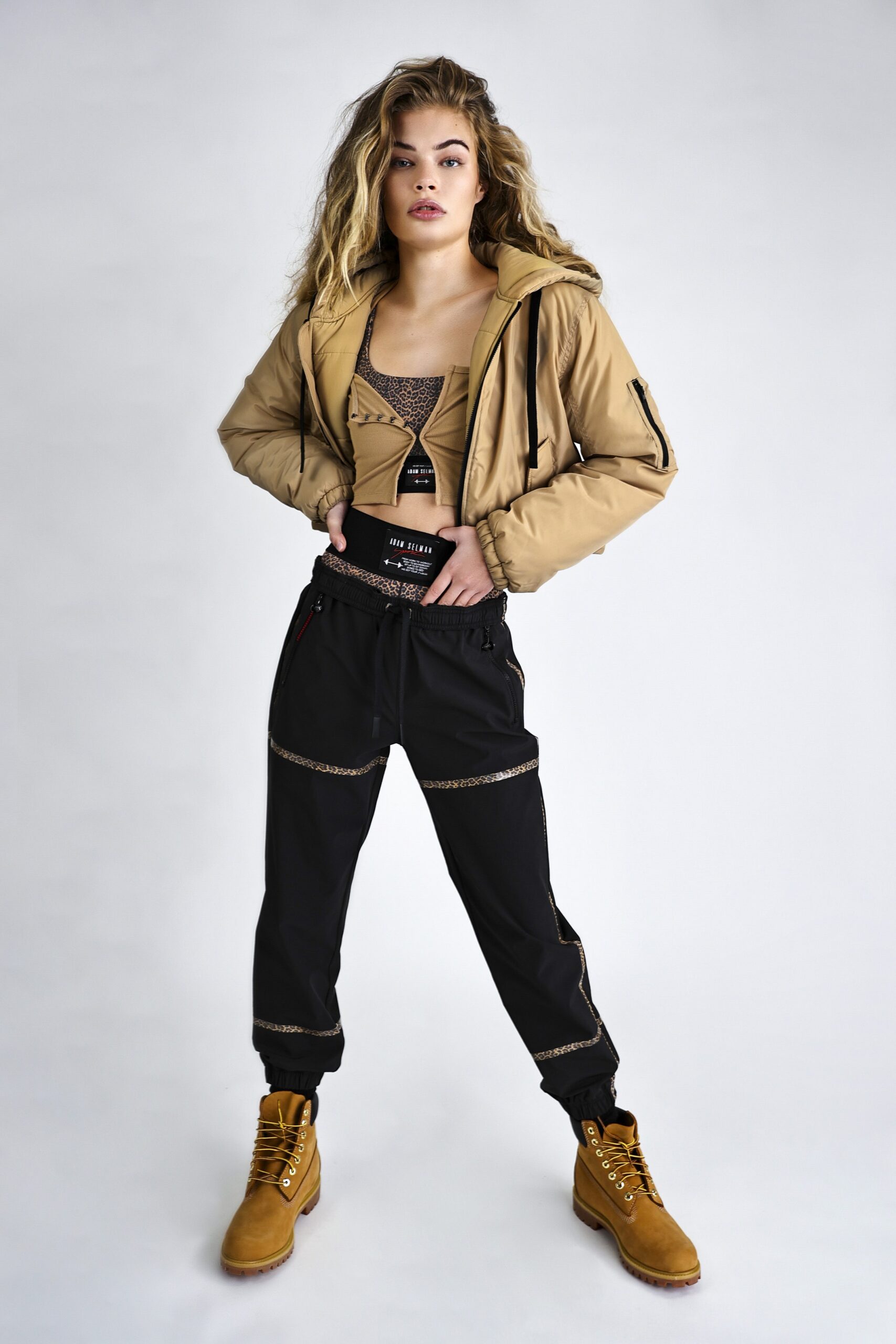 beige jacket black top relaxed pants