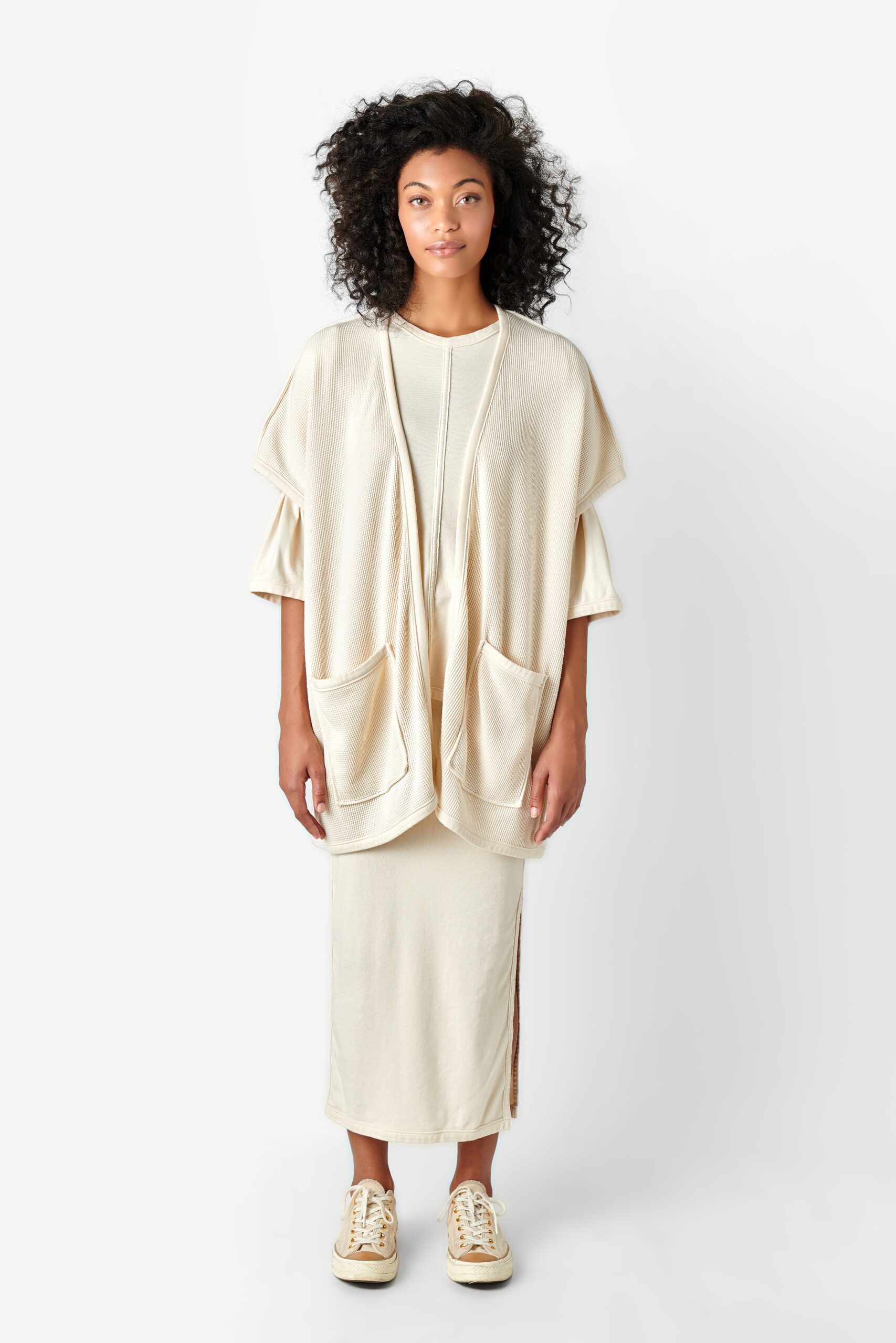 beige relaxed top and fitted midi skirt