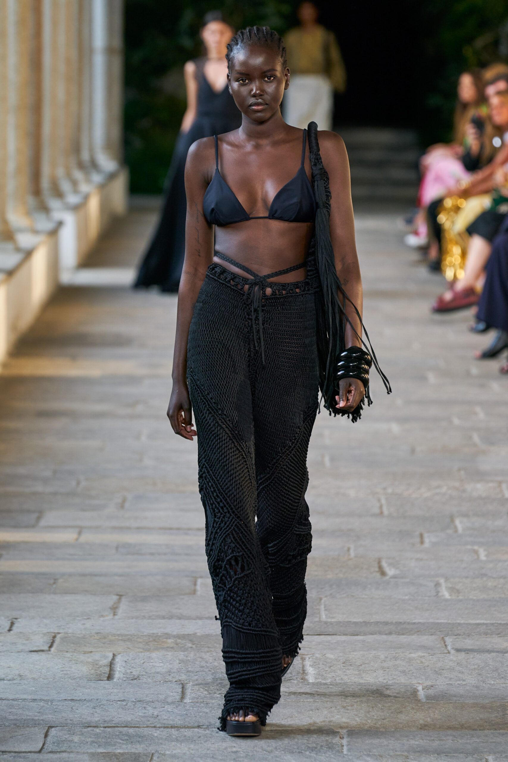 black fitted top and relaxed pants