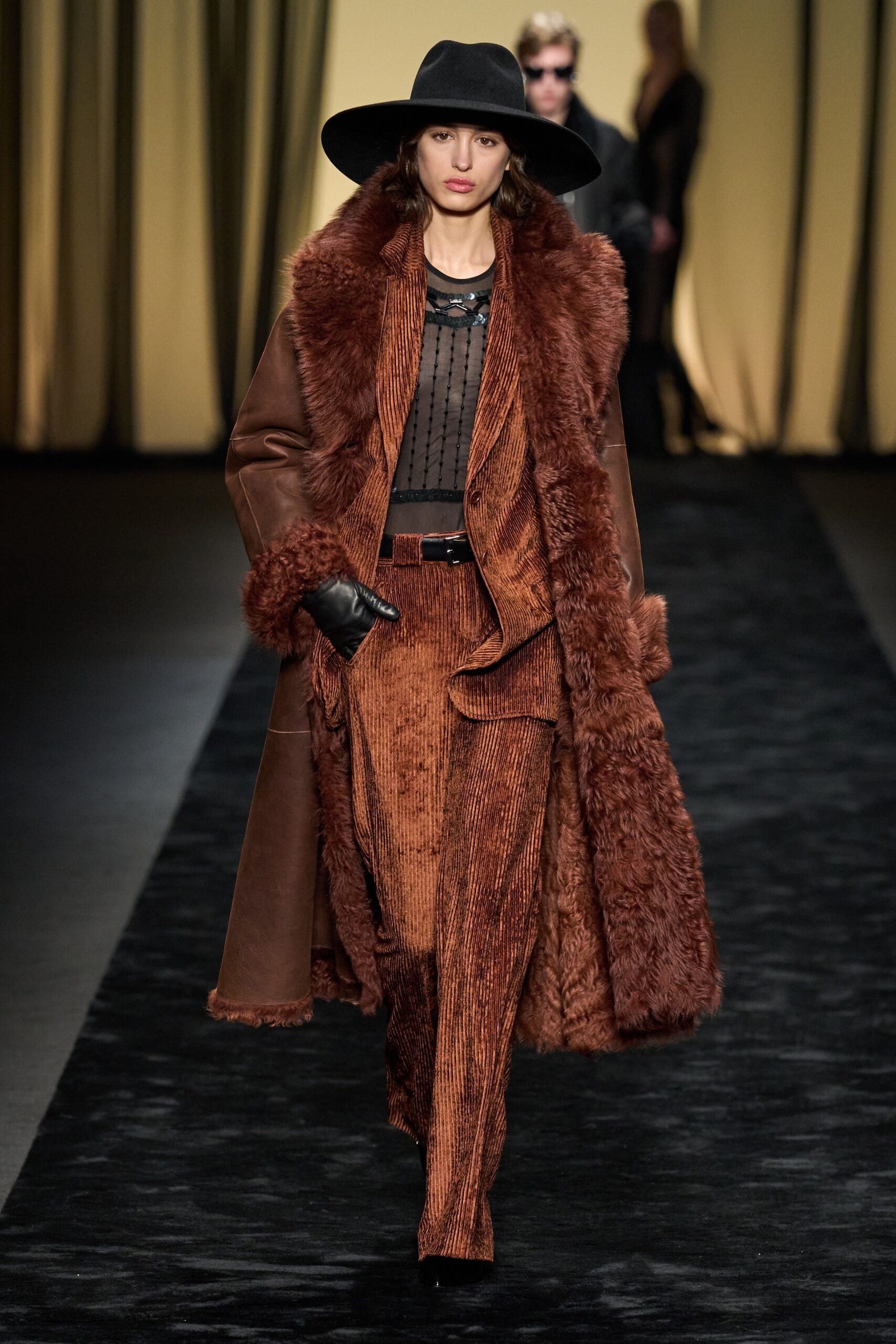 brown fur coat with black blouse