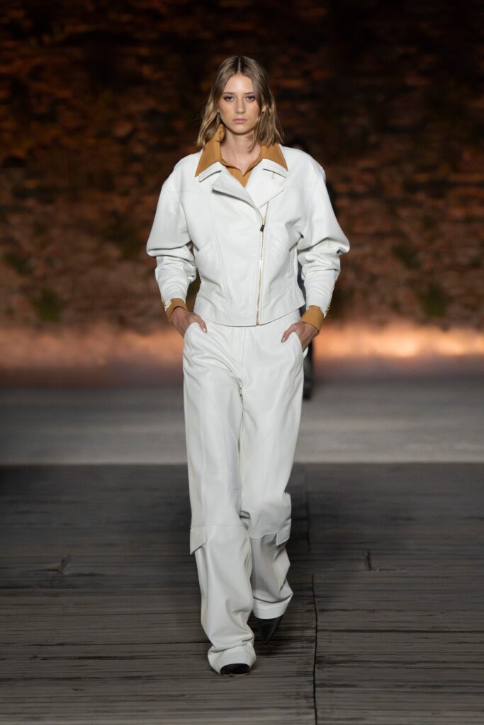 A relaxed white leather jacket with a collared neckline paired with matching pants.