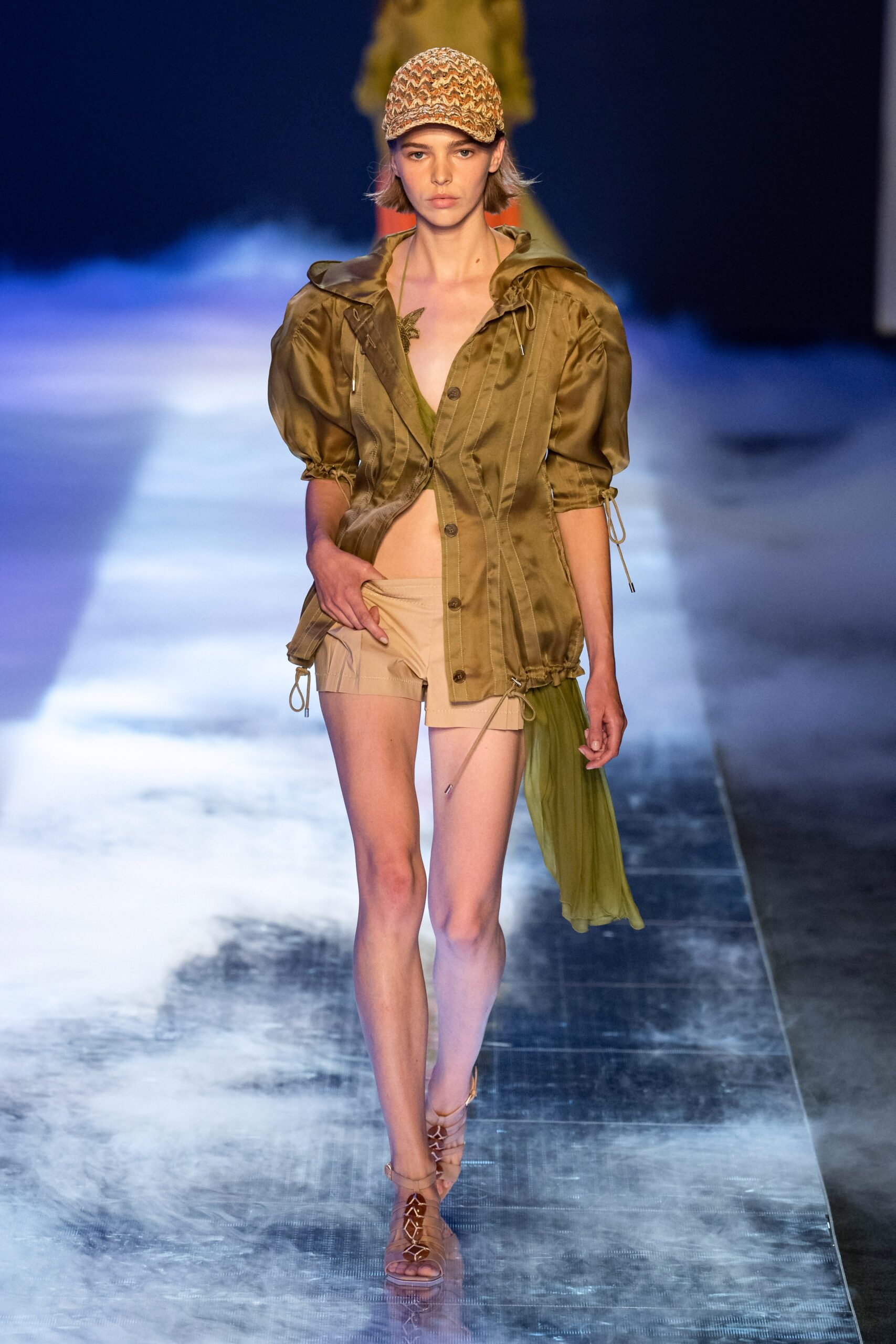 brown fitted jacket with beige shorts