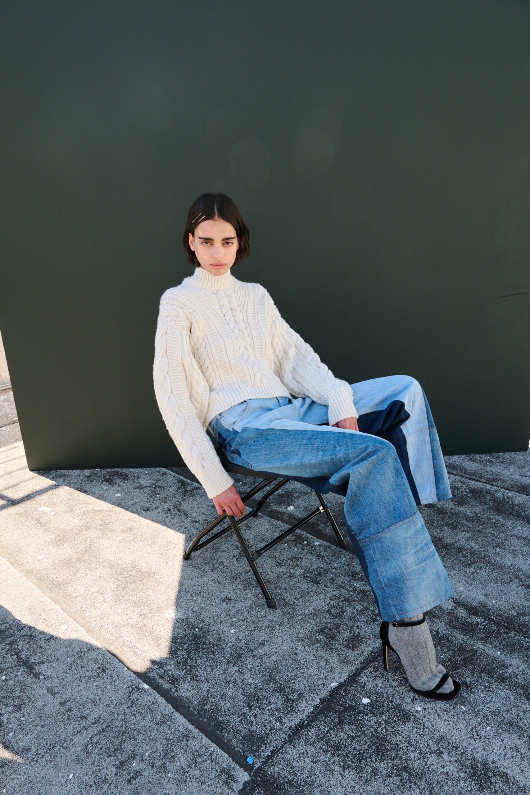 white wool fitted sweater with relaxed jeans