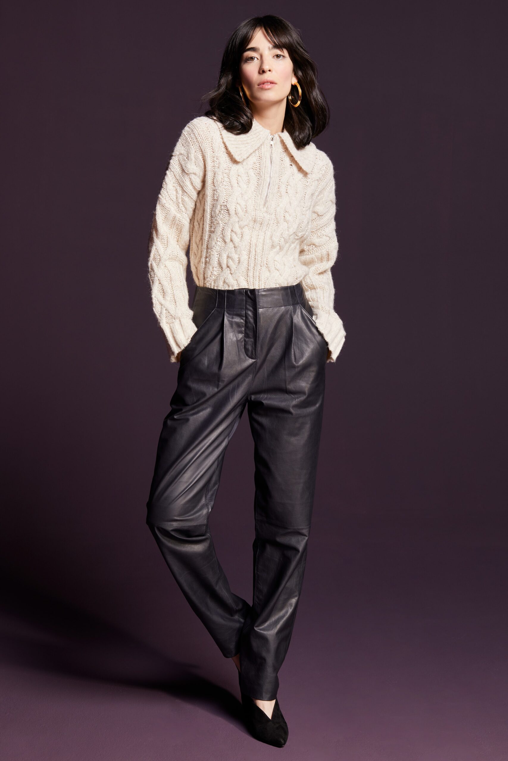 beige wool sweater with black leather pants