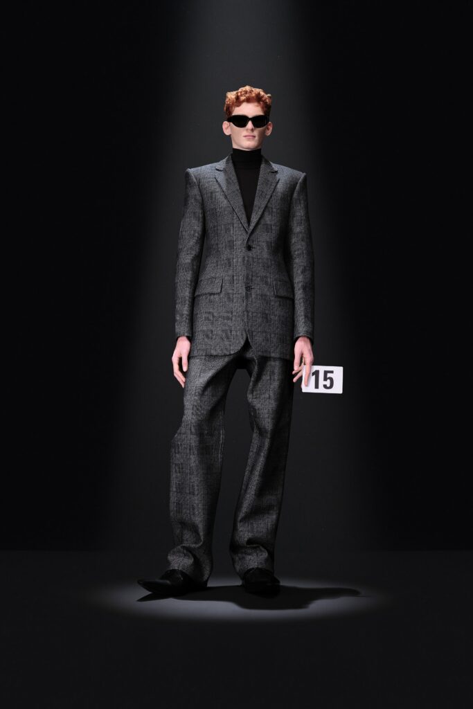 gray tailored suit with black turtleneck