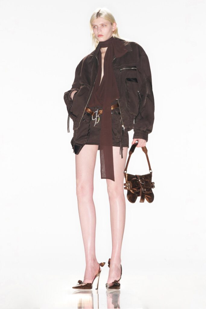 A relaxed brown cotton jacket with long sleeves and collared design paired with matching shorts.
