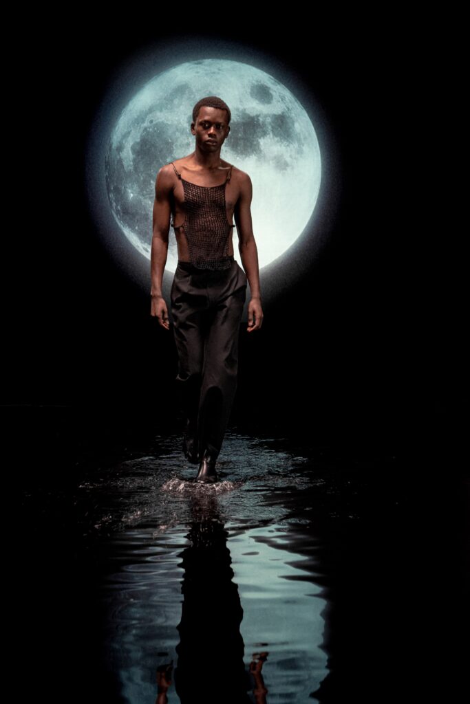 black mesh sleeveless top and pants