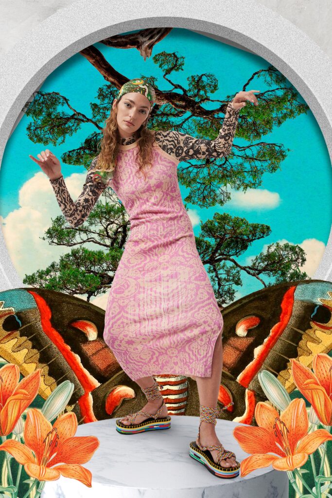 A fitted pink cotton dress with a high neckline and side slit detail.