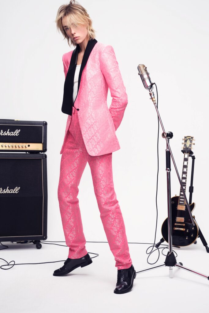 A tailored pink silk suit with a long-sleeve collared jacket and printed design.