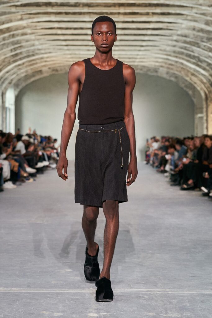 black fitted tank-top with pleated shorts