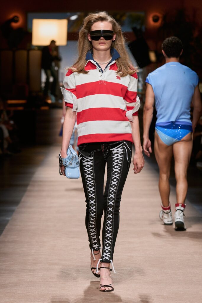 A fitted red and white striped short-sleeve top paired with black skinny pants.