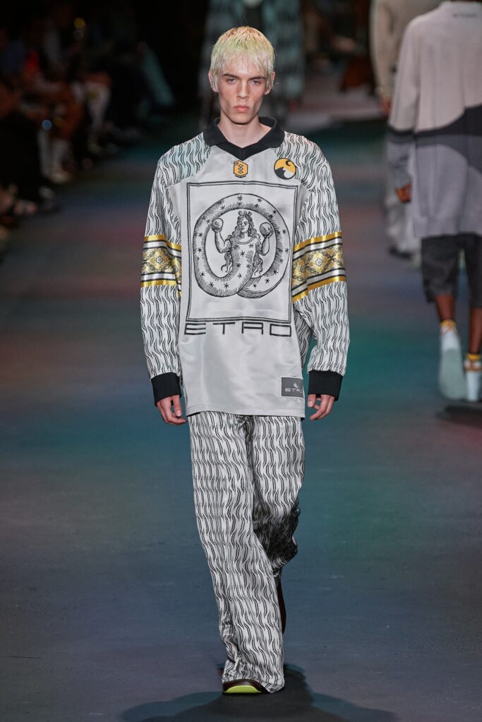 A relaxed gray cotton sweater with long sleeves and printed pants, creating a stylish ensemble.