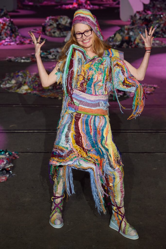 A relaxed multicolor sleeveless dress with a V-neckline and fringed details.