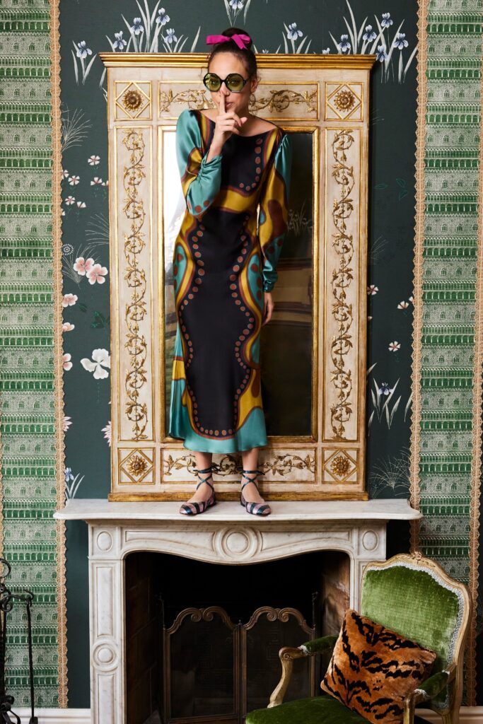 A fitted long-sleeve dress with a V-neckline and vibrant printed design.
