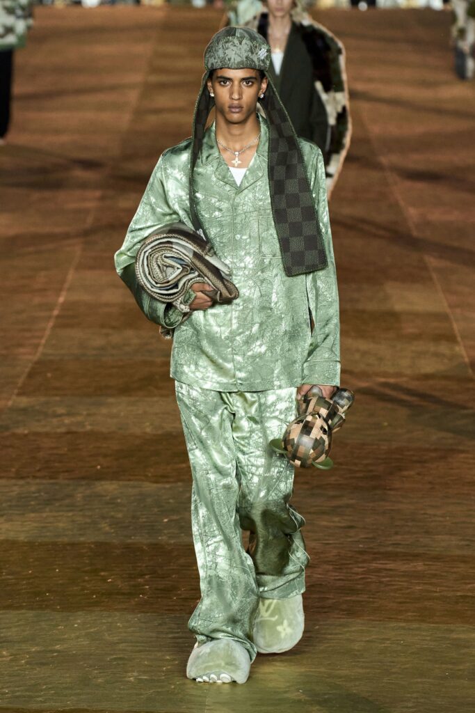 A relaxed green silk shirt with long sleeves and matching pants featuring a printed design.