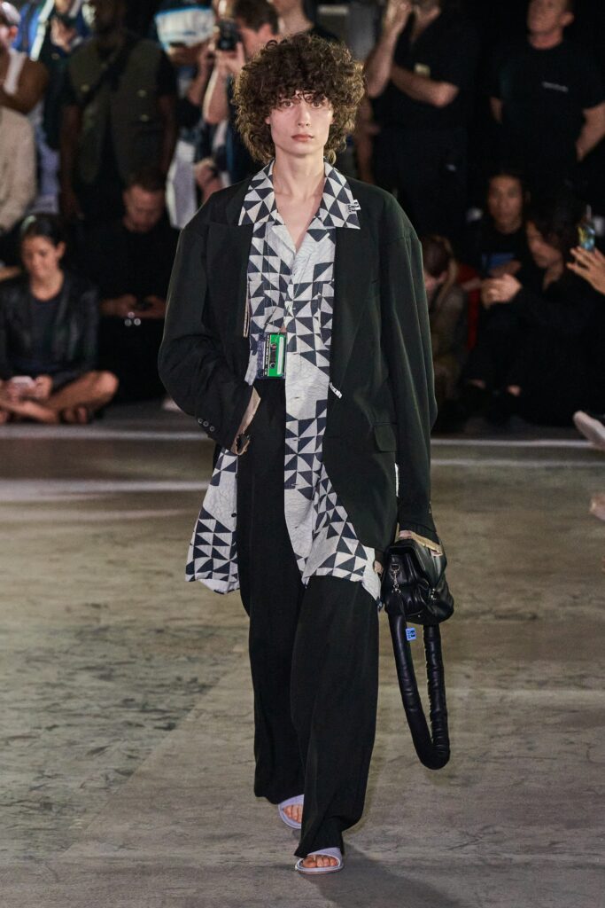 A relaxed fit black and white printed jacket paired with matching pants.