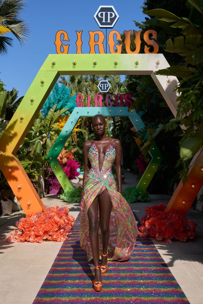 A fitted multicolor silk sleeveless dress with a V-neckline and tiered design.