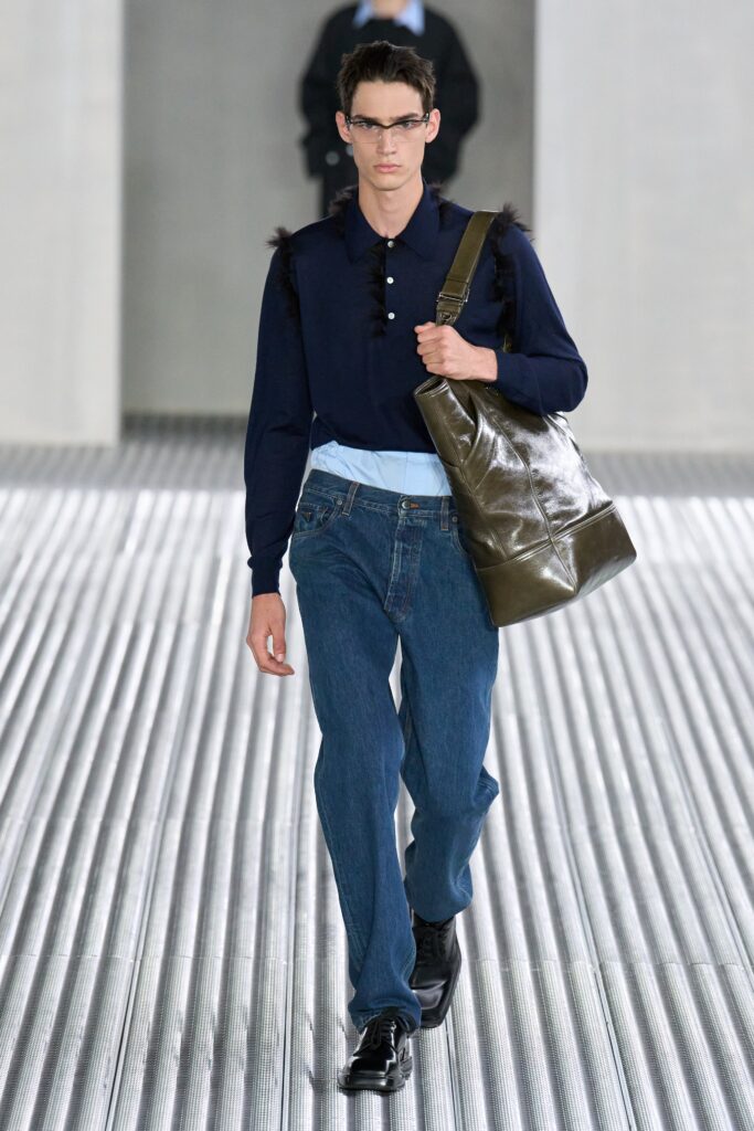 A relaxed blue cotton long-sleeve shirt paired with straight-leg pants for a casual look.