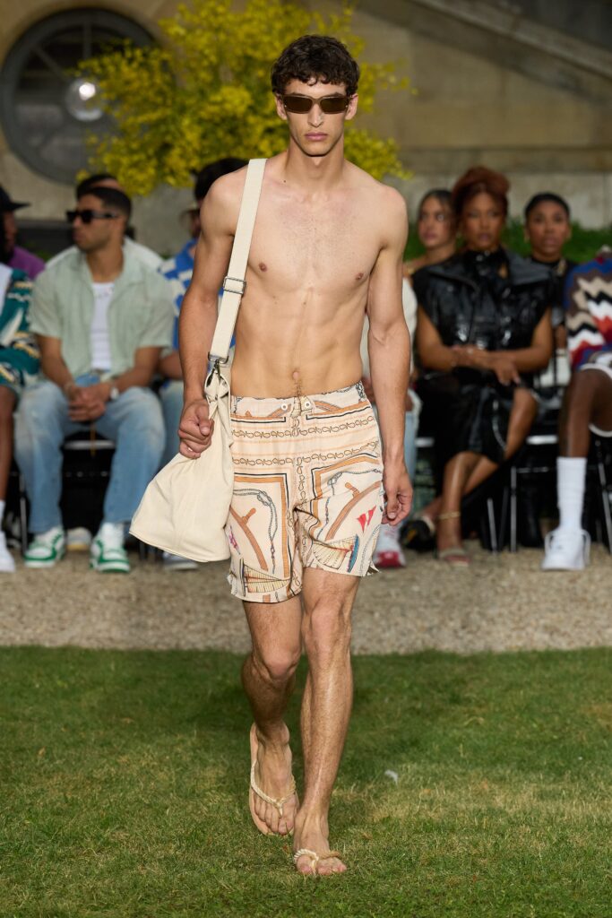 Relaxed beige cotton shorts with a printed design, perfect for casual summer wear.