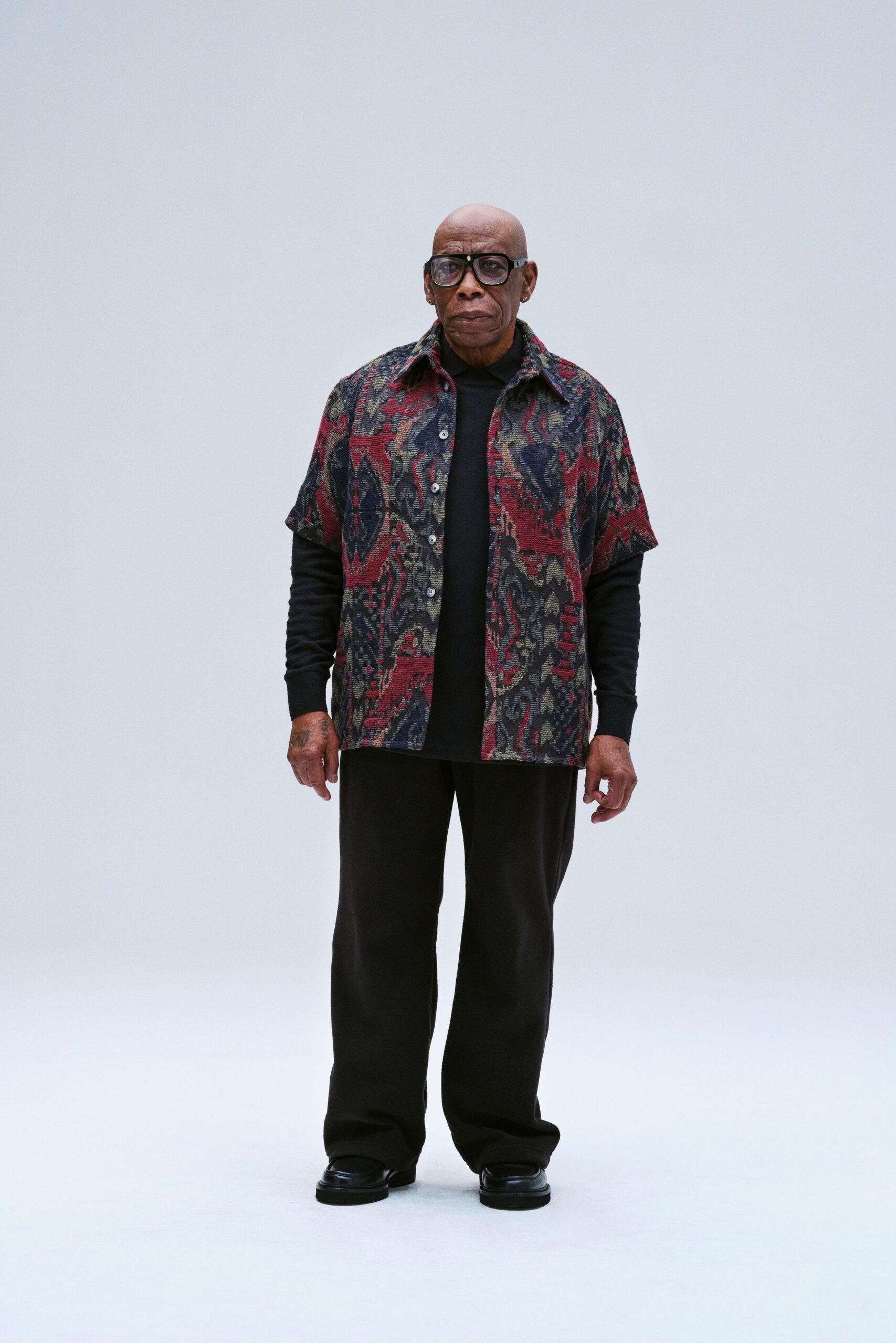 A relaxed fit short-sleeve printed shirt paired with black pants for a stylish look.
