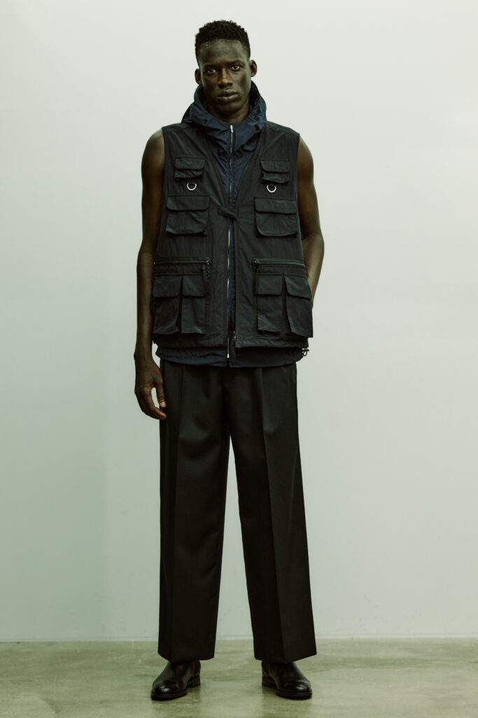 black relaxed vest and tailored pants