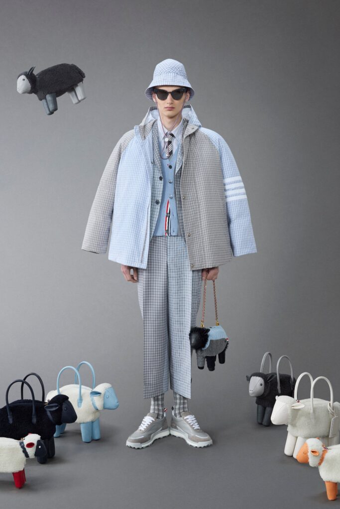 A relaxed blue and gray checked jacket paired with matching pants, featuring a layered design.