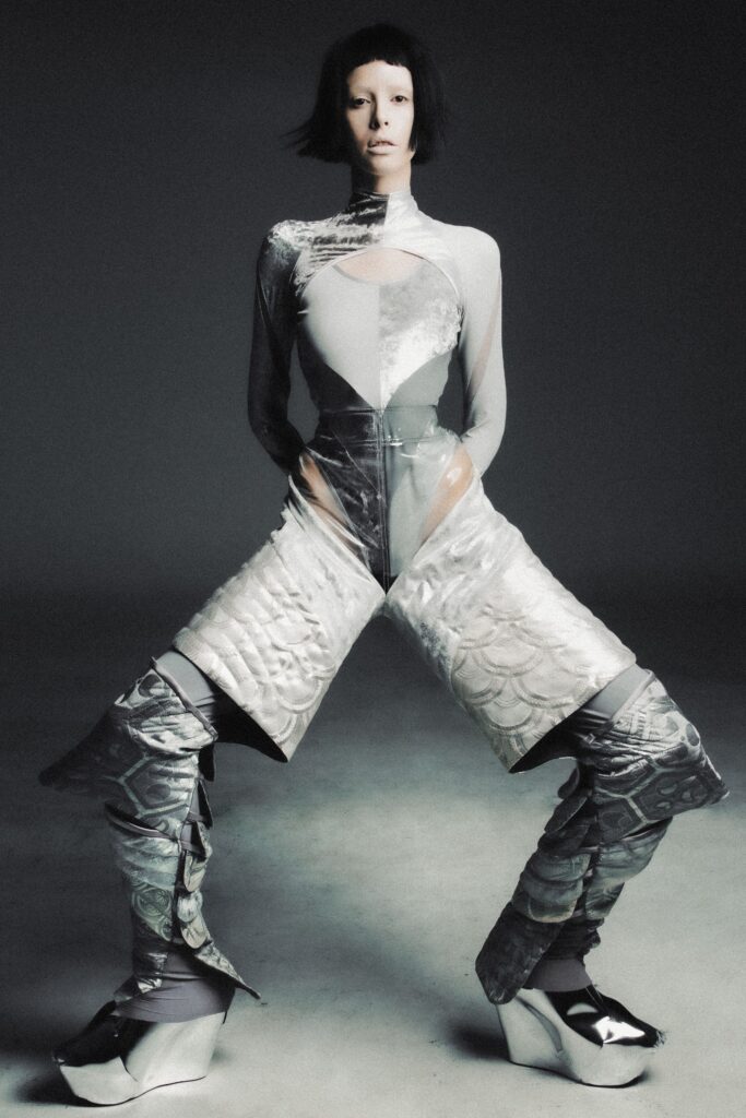 gray vinyl fitted catsuit with boots