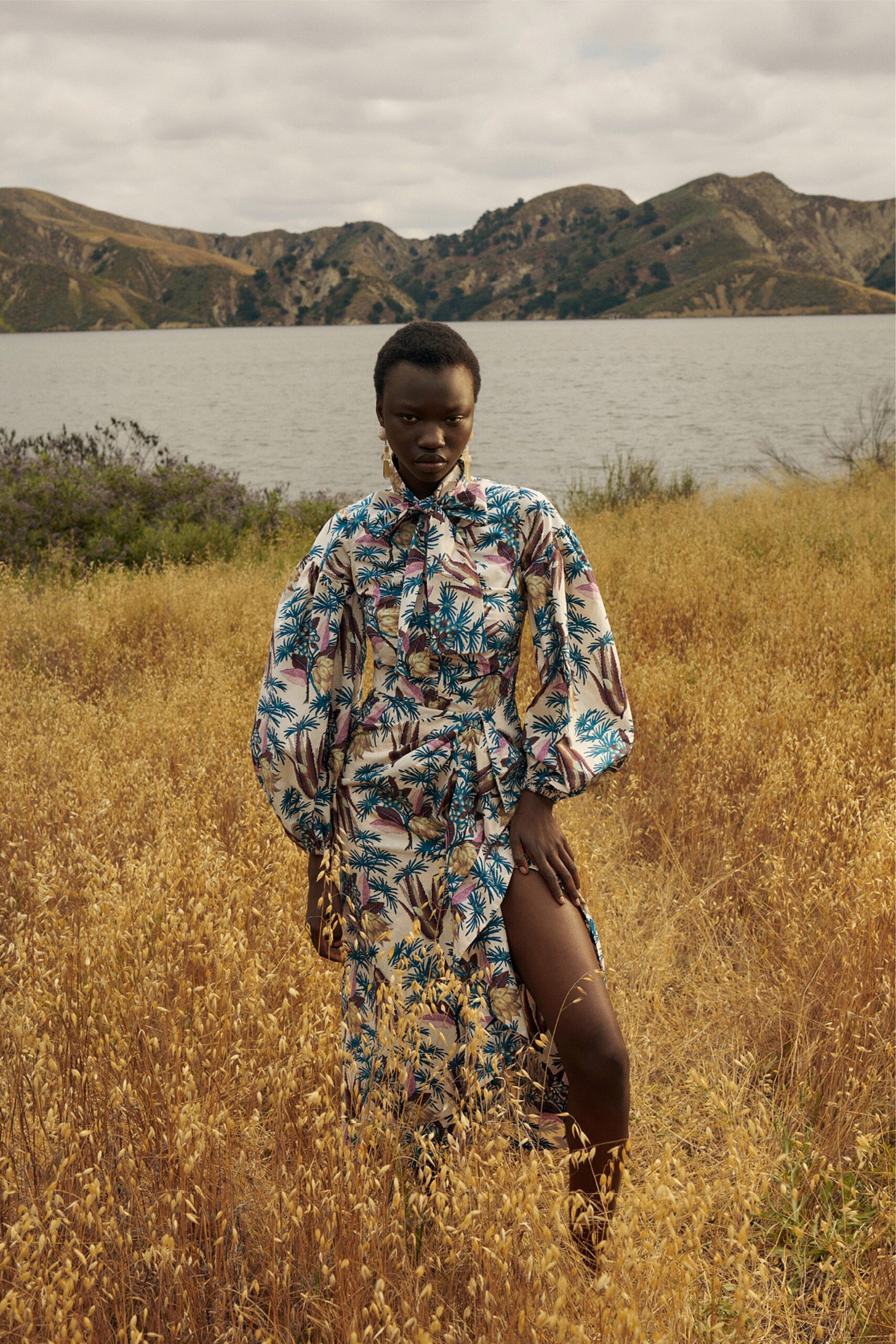 A relaxed multicolor printed dress with long sleeves and a collared neckline.