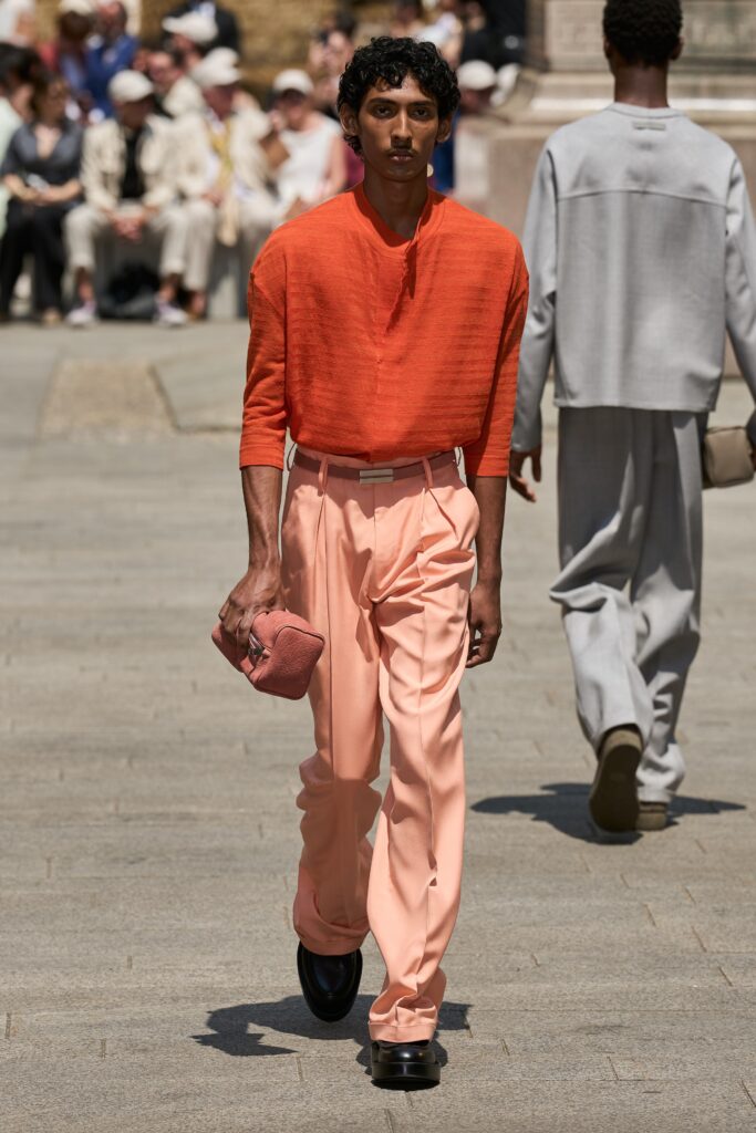 A relaxed orange cotton long-sleeve shirt paired with straight-leg pink pants.