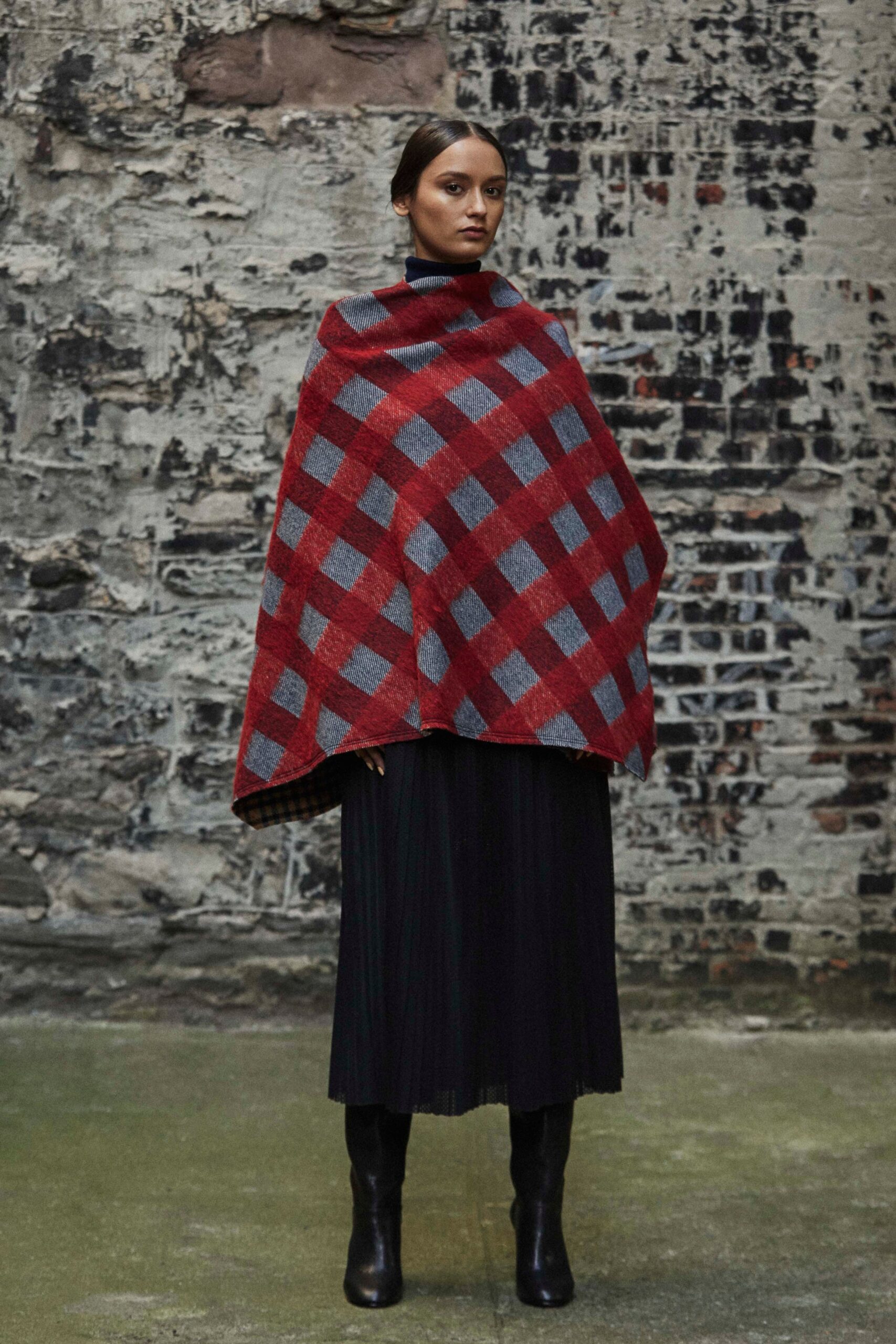 red checked poncho with black skirt