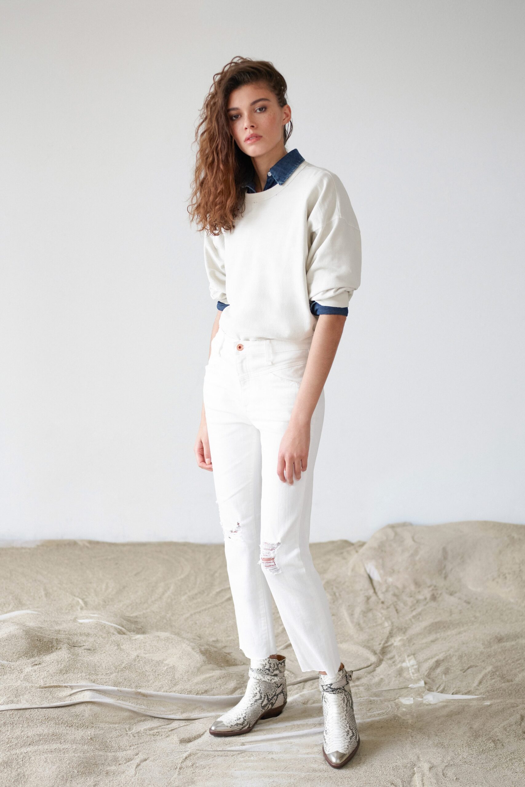 white relaxed sweater with blue shirt