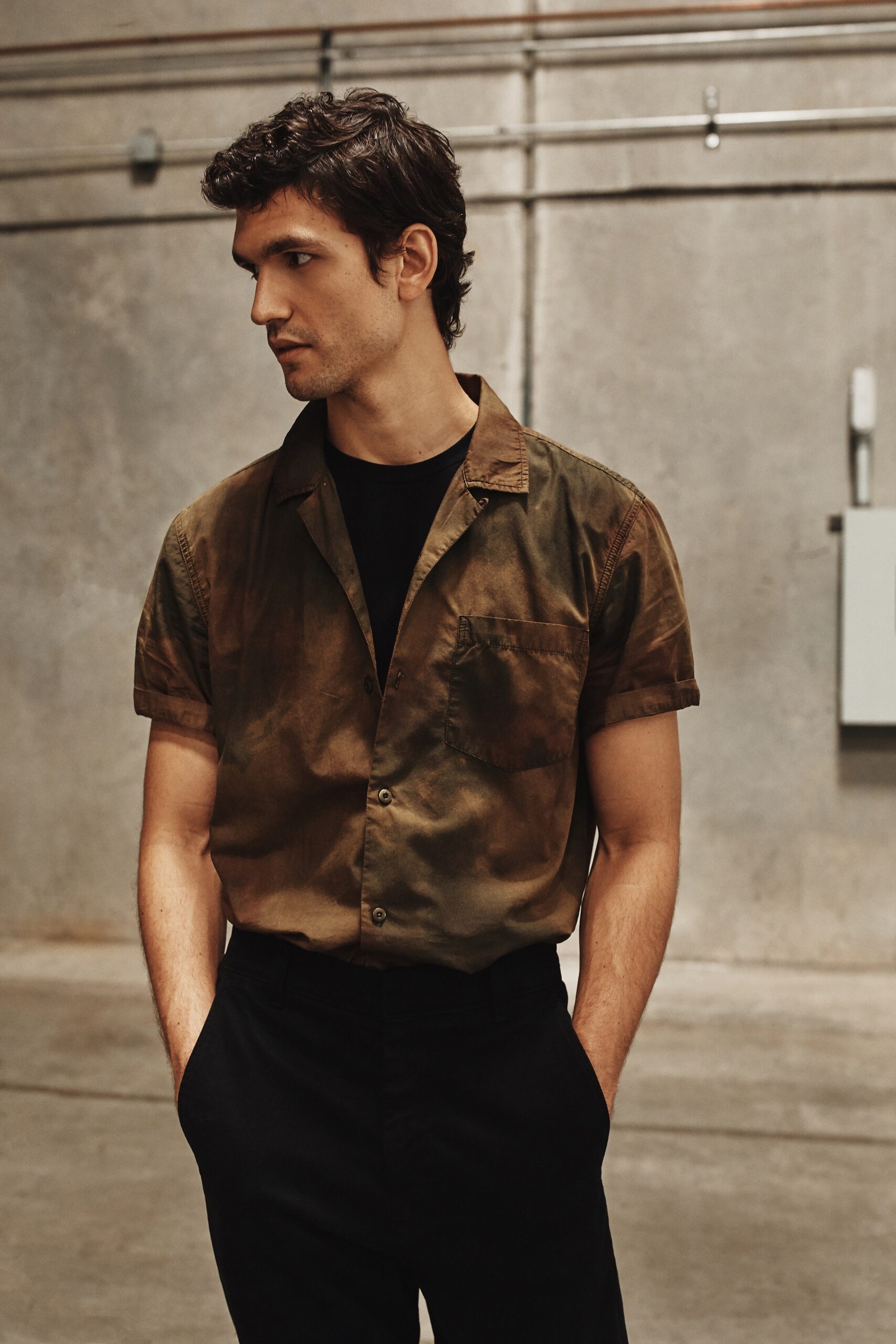 brown green short-sleeve shirt with black tailored pants