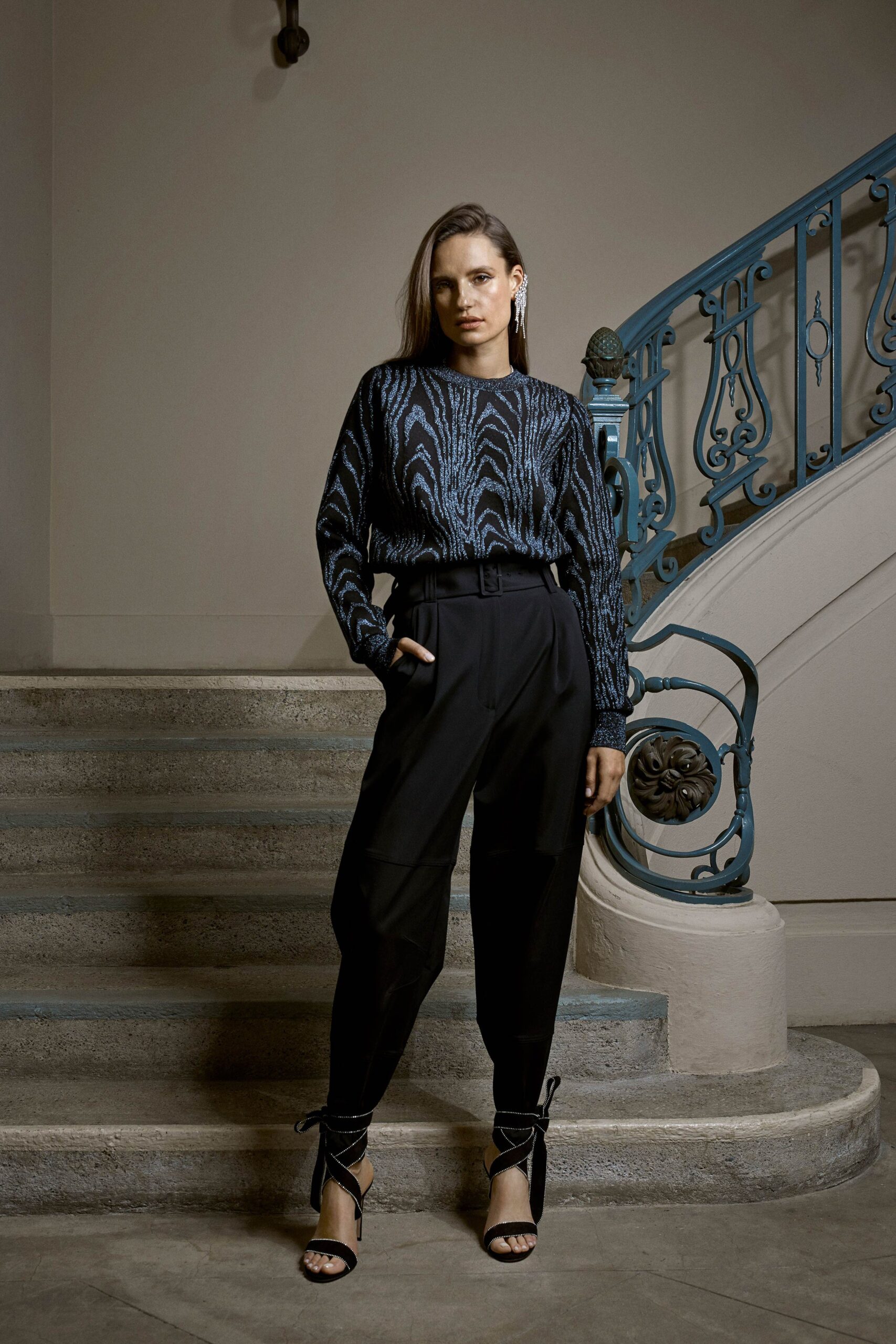 fitted black sweater and tailored pants