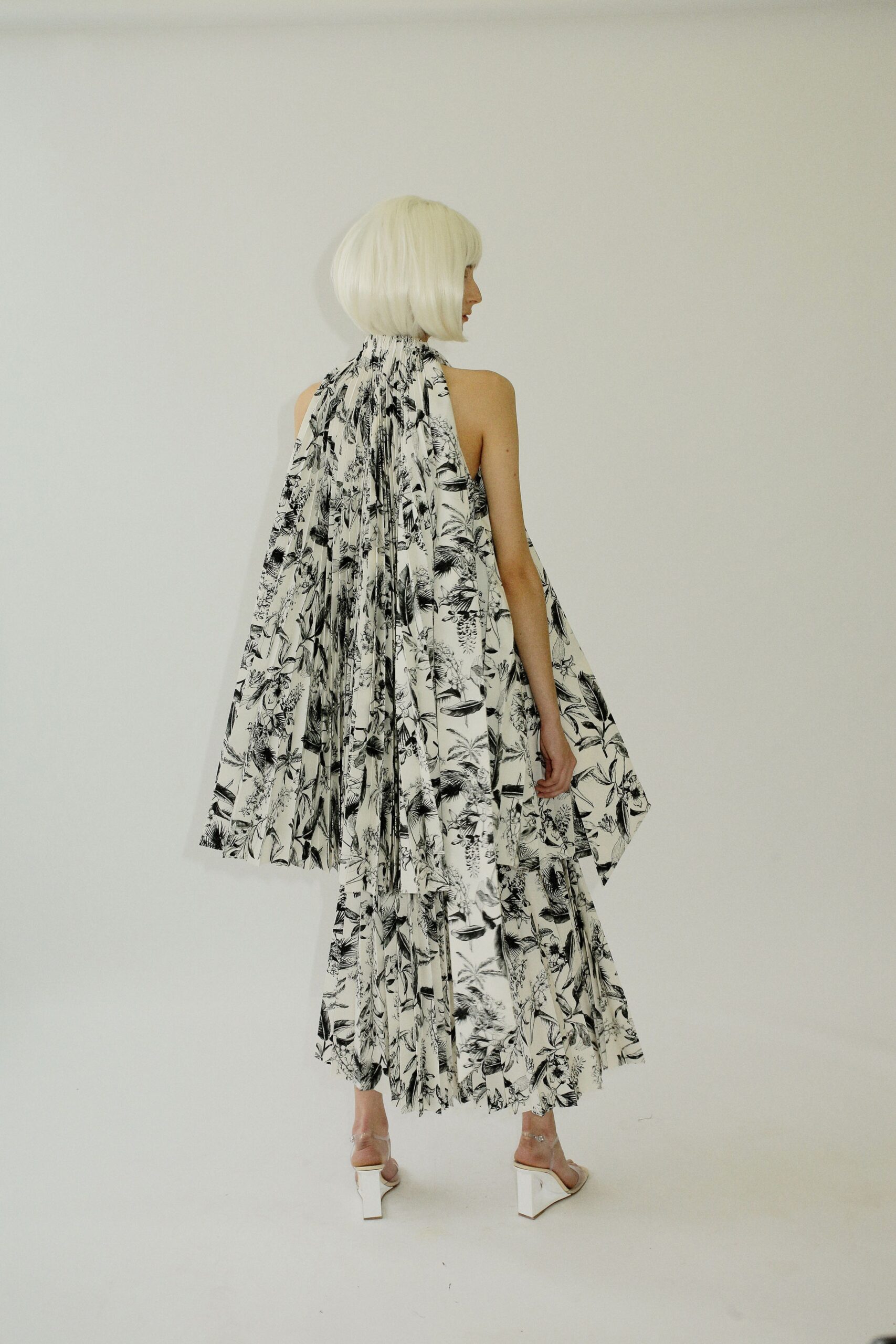 black and white tiered dress with cape