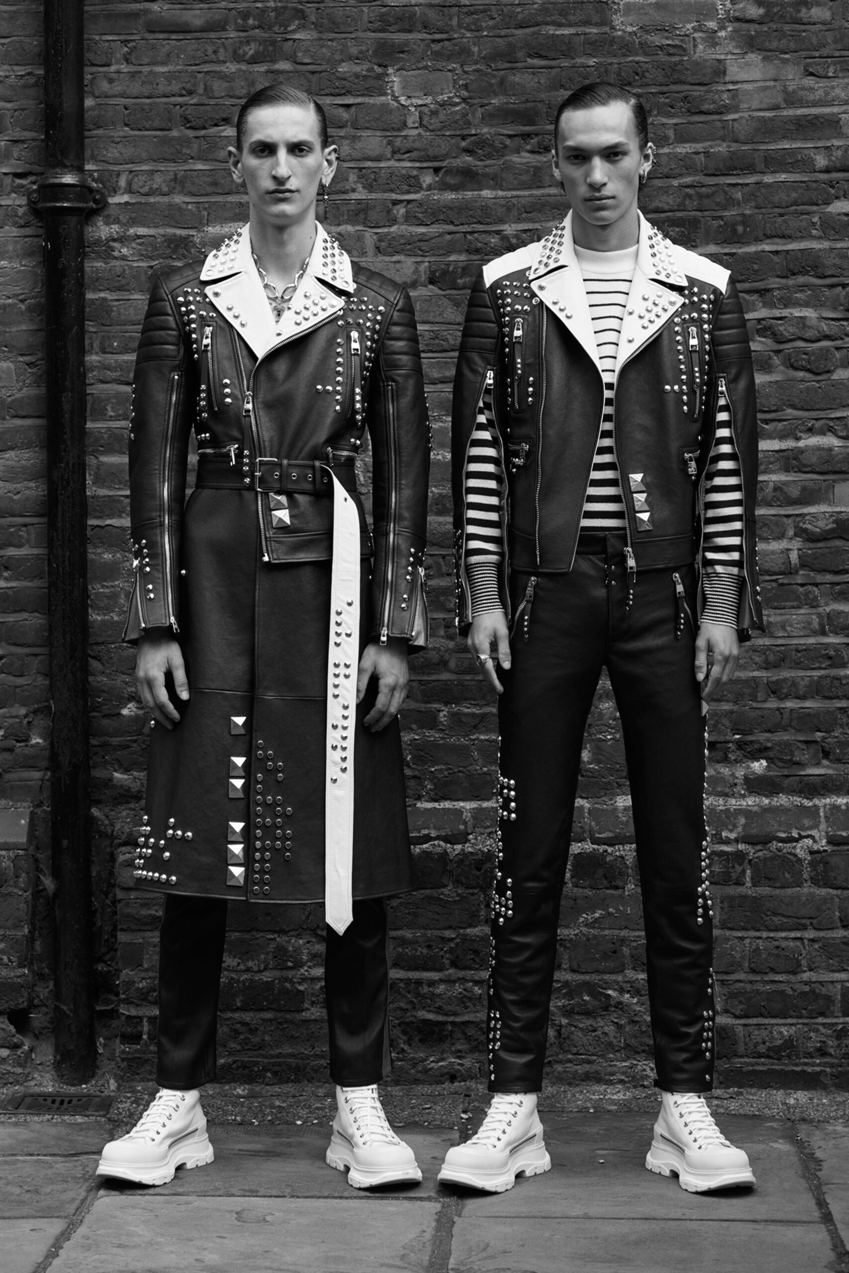 black leather long-sleeve collared fitted zippered buttoned coat