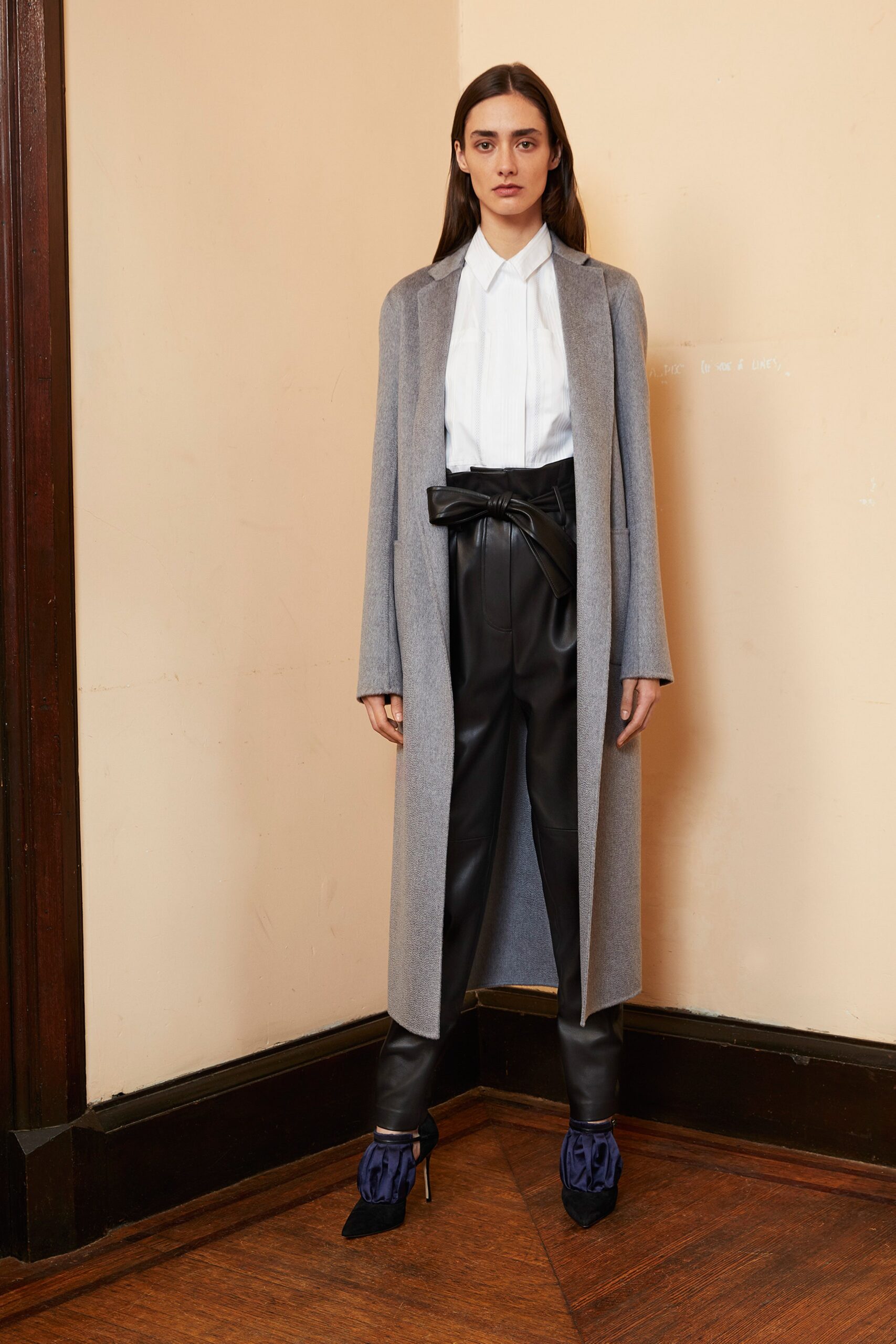 gray wool coat with black leather pants