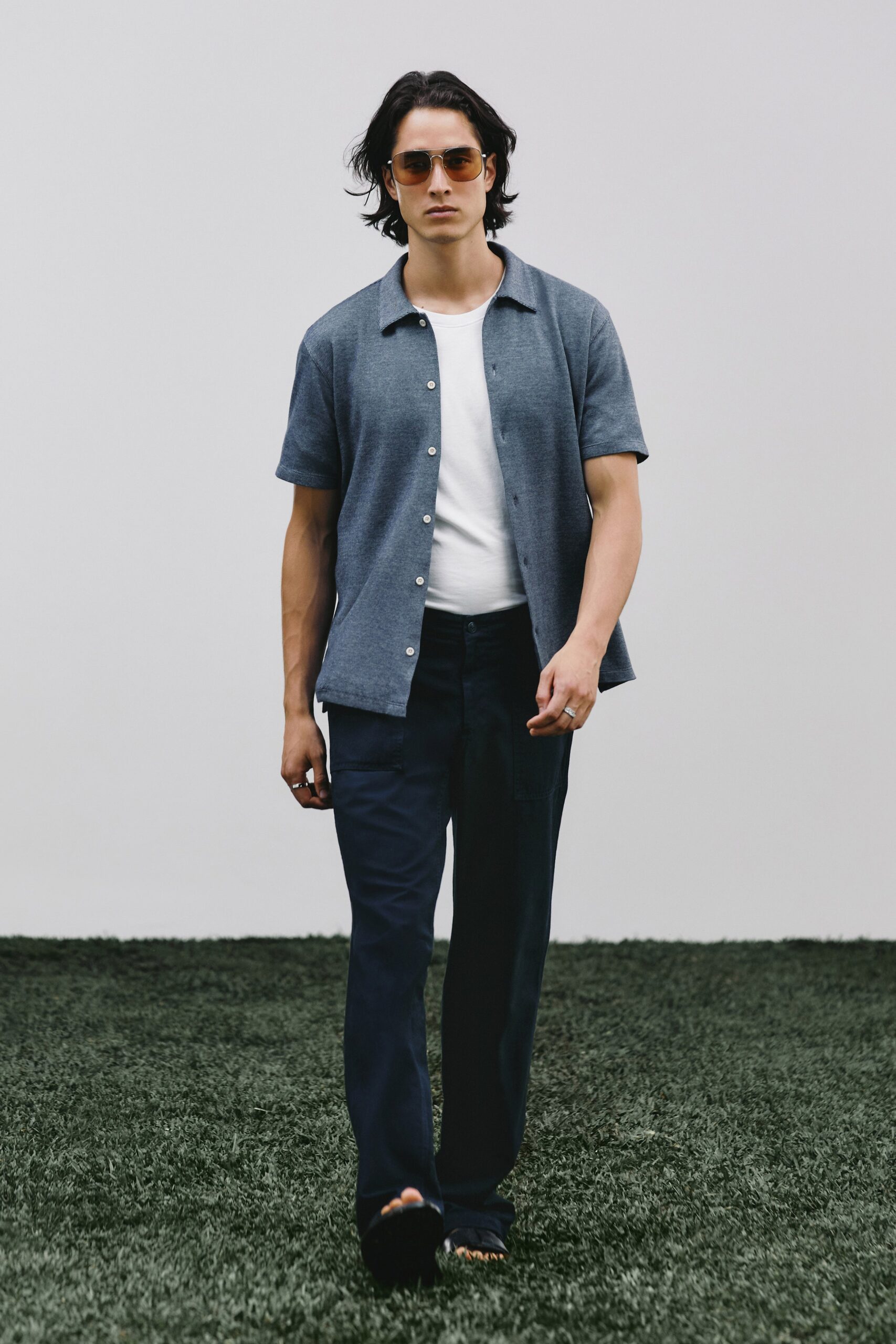 blue shirt white t-shirt black pants