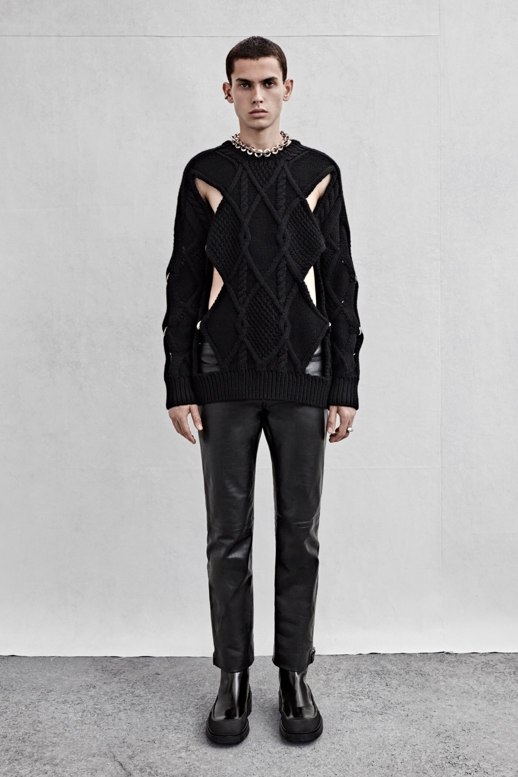 black fitted sweater and leather pants
