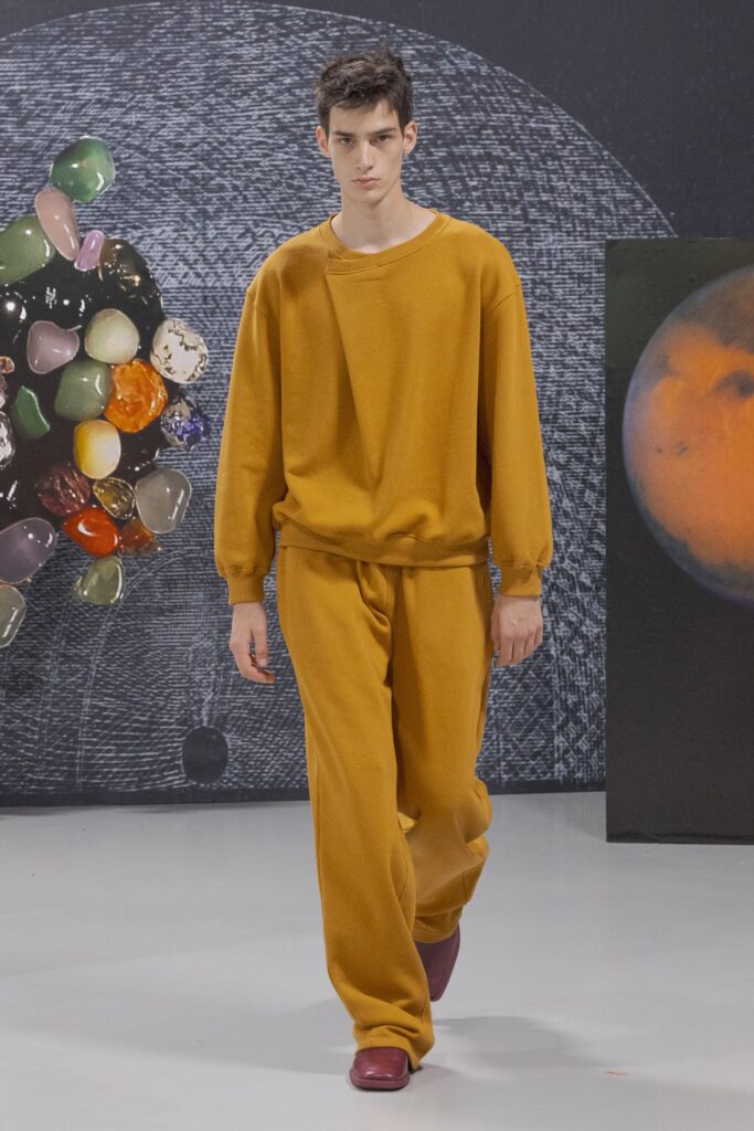 A relaxed orange cotton sweater paired with matching pants, perfect for a casual look.