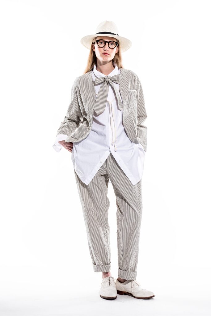 A relaxed gray striped jacket paired with matching pants and a collared shirt.