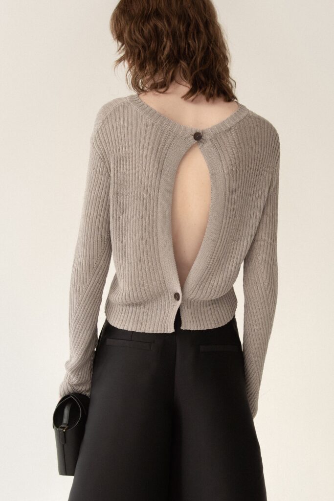 beige ribbed top and black tailored pants