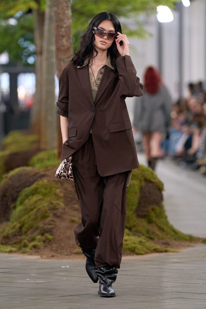 brown relaxed suit with sunglasses